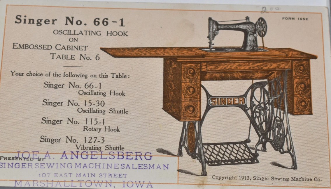 Antique Singer sewing machine in cabinet